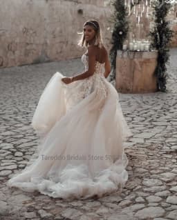 Customized Breathtaking Strapless Wedding Dress Featuring Stunning Crystals Lace Appliques and Flowy Silhouette Bridal Dress