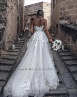 Customized Breathtaking Strapless Wedding Dress Featuring Stunning Crystals Lace Appliques and Flowy Silhouette Bridal Dress