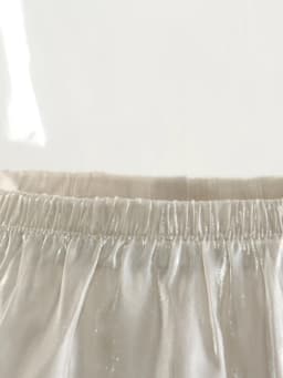[EAM] High Elastic Waist Champagne Glossy Ruffles Irregular Half-body Skirt Women Fashion Tide New Spring Autumn 2026 1DJ0349