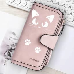 Featuring a cat motif this women's long wallet offers multiple card slots a coin pocket and a cell phone pouch A perfect gift