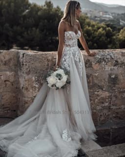 Customized Breathtaking Strapless Wedding Dress Featuring Stunning Crystals Lace Appliques and Flowy Silhouette Bridal Dress