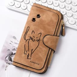 Featuring a cat motif this women's long wallet offers multiple card slots a coin pocket and a cell phone pouch A perfect gift