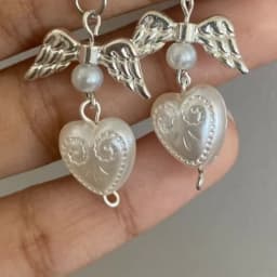 white coquette pearl angel earrings