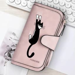 Featuring a cat motif this women's long wallet offers multiple card slots a coin pocket and a cell phone pouch A perfect gift