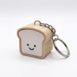 1PC 3.5cm Cute Pressable Stress Relief Keychain Soft Silicone Bread Keychain Set, Kawaii Toast Bread Shape Smiling Face Beige &