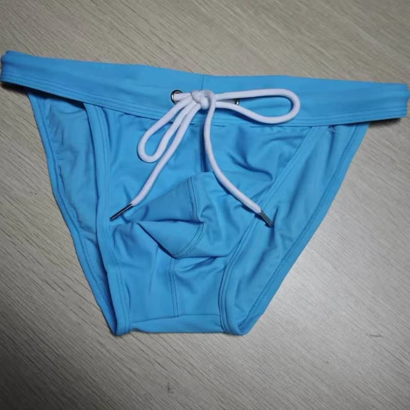 2026 New's slender waist men's swimming trunks foreign trade triangle swimsuit European and American new fashion D101