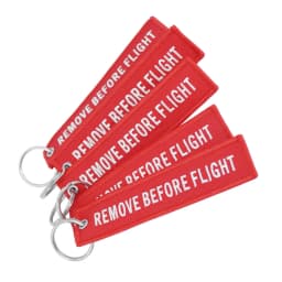 50Pcs Aviation‑style keychain: embroidered red ribbon with white text “Remove Before Flight” for backpacks & cars key ring