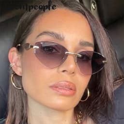 Sexy Cat Eye Rimless Punk Sunglasses Women New 2026 Luxury Designer Trendy Frameless Polygon Sun Glasses Vintage Metal Shades