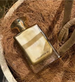 Jubilation 40, a luxurious golden fragrance with rich warm notes. Elegant bottle design, perfect for special occasions, gifts and personal collection.