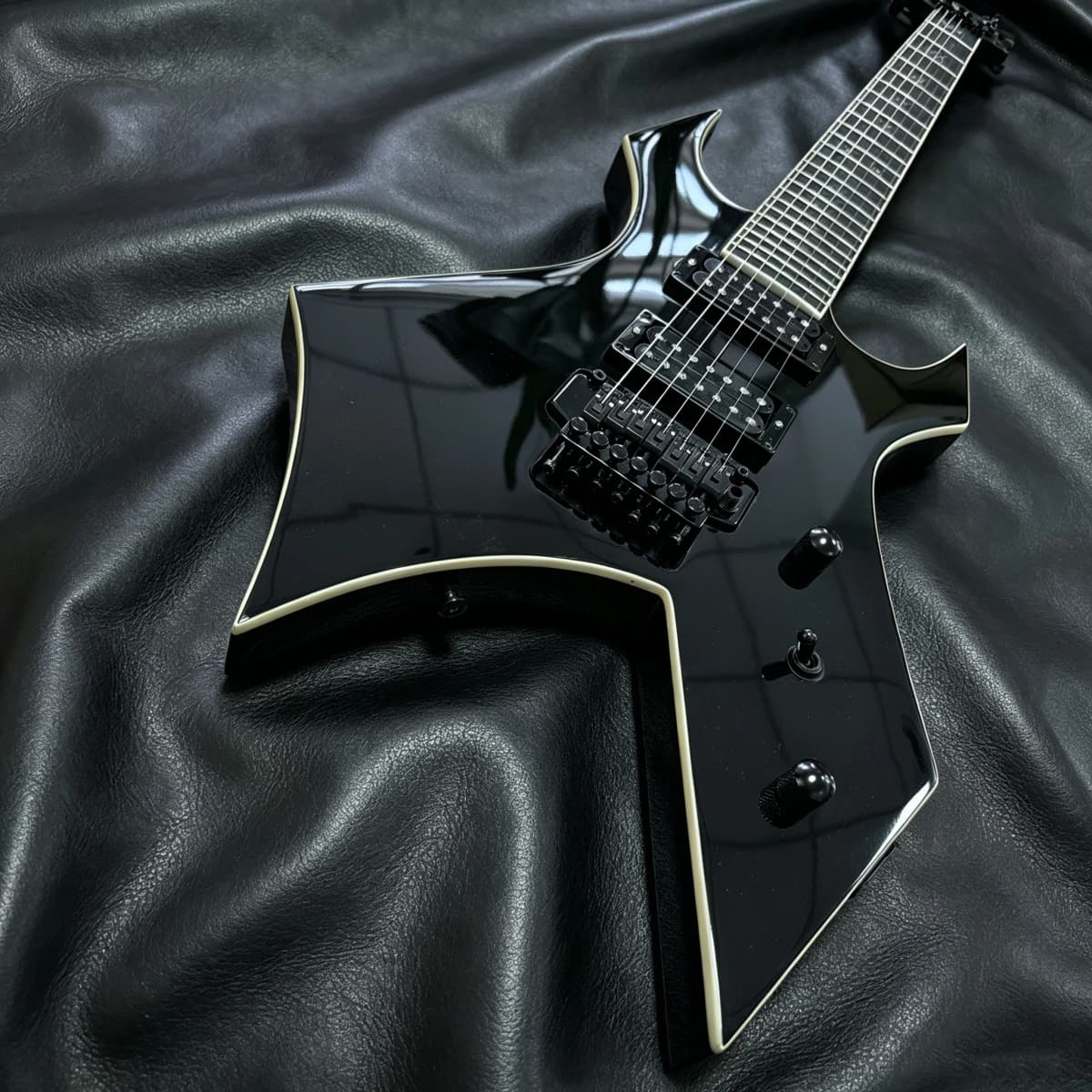 7-String Electric Guitar with Shiny Black High-Gloss Finish and Dual Coil Pickups. Heavy Metal Style. Classic Guitar Shape. Black Fretboard. Embedded Special Pattern Frets. US Warehouse Stock. Free Shipping.