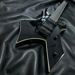 7-String Electric Guitar with Shiny Black High-Gloss Finish and Dual Coil Pickups. Heavy Metal Style. Classic Guitar Shape. Black Fretboard. Embedded Special Pattern Frets. US Warehouse Stock. Free Shipping.