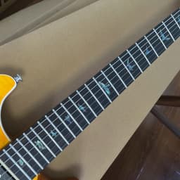 Solid-body electric guitar with golden lacquer tiger-striped maple veneer, pearl shell inlay trim, dual pickups. Suitable for rock music. Christmas gift. Available in US warehouse. Free shipping.