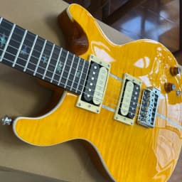 Solid-body electric guitar with golden lacquer tiger-striped maple veneer, pearl shell inlay trim, dual pickups. Suitable for rock music. Christmas gift. Available in US warehouse. Free shipping.