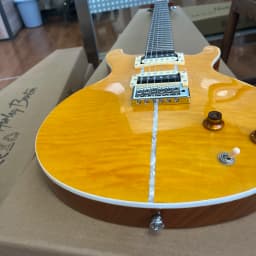 Solid-body electric guitar with golden lacquer tiger-striped maple veneer, pearl shell inlay trim, dual pickups. Suitable for rock music. Christmas gift. Available in US warehouse. Free shipping.