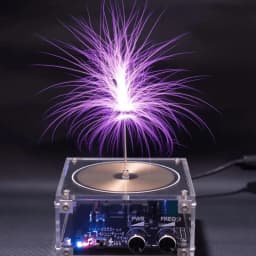 Tesla coil speaker with plasma storm effect. Cool desktop gadget with artificial lightning, creative decorative gift.