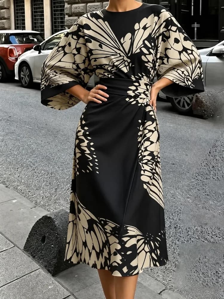 The New Fashionable Ladies Satin Mid-Length Dress Features a High-Waist, Form-Fitting and Anti-Wrinkle Design. It Has Black and White butterfly Prints, Batwing Sleeves and Loose-Fitting A-Line Cut. The Elegant V-Neck A-Shaped Skirt Design Is Suitable for