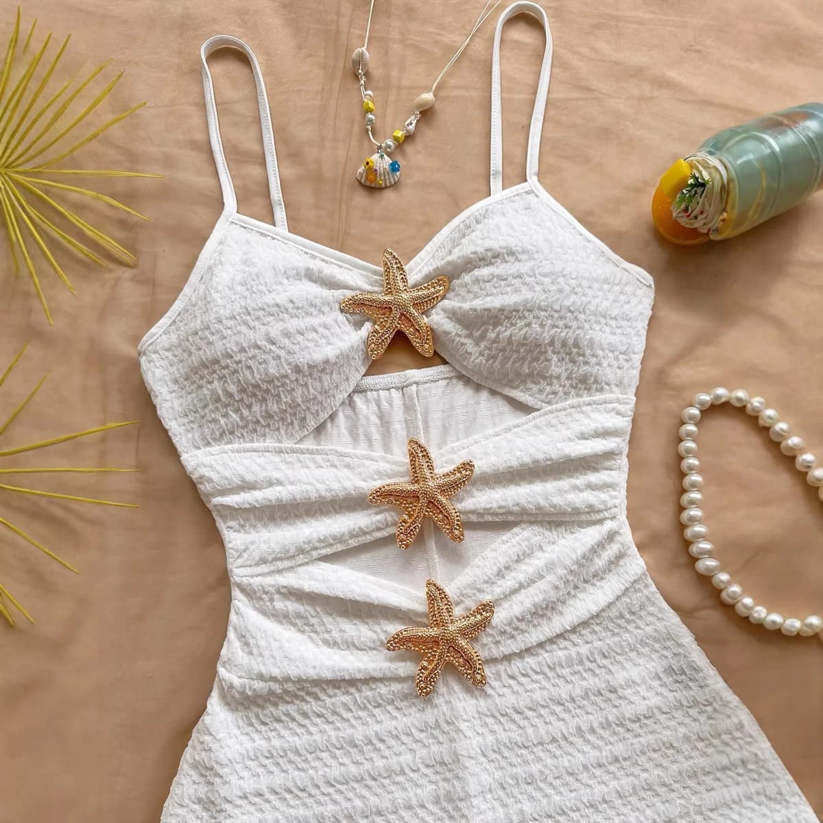 Solid color one-piece swimsuit, feminine, tight-fitting, hollowed-out, metallic five-pointed star.