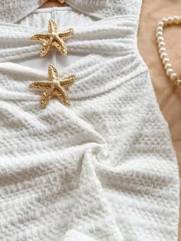 Solid color one-piece swimsuit, feminine, tight-fitting, hollowed-out, metallic five-pointed star.