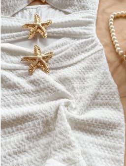 Solid color one-piece swimsuit, feminine, tight-fitting, hollowed-out, metallic five-pointed star.