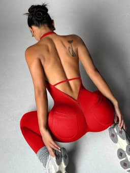 Women's solid color vest style seamless elastic sports jumpsuit with pocket design