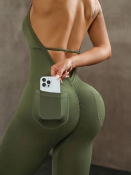 Women's solid color vest style seamless elastic sports jumpsuit with pocket design