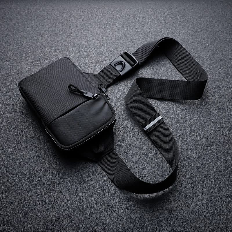 A stylish men's mini crossbody bag, crafted from nylon fabric, featuring a honeycomb-patterned back panel designed to hold a mob