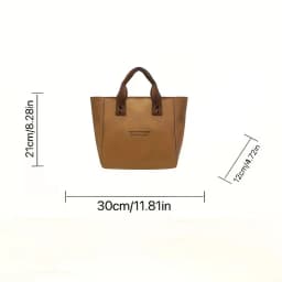 A Casual Canvas Tote Bag with a Bell Pendant and Zipper Closure; This Stylish and Durable Tote Bag Is Perfect for School and Work