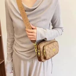Original Circular-Pattern Logo Crossbody: Retro-luxury, durable fabric, adjustable strap. Ideal for daily/work/social use