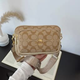 Original Circular-Pattern Logo Crossbody: Retro-luxury, durable fabric, adjustable strap. Ideal for daily/work/social use