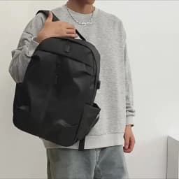 Men's water-resistant backpack with spacious compartments, perfect for laptops, travel, business, and student use