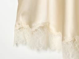 European and American style women's clothing new 2026 fashionable lace hem cross slit irregular skirt