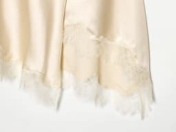 European and American style women's clothing new 2026 fashionable lace hem cross slit irregular skirt