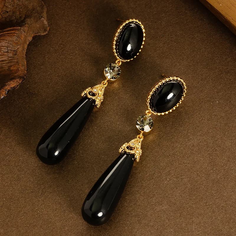 Retro style palace style long large water drop resin drop earrings light luxury high-end face slimming tassel commuter earrings