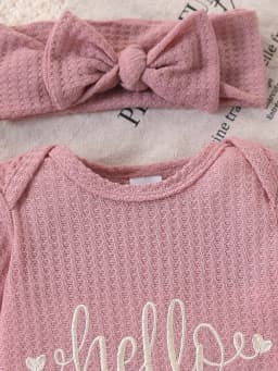 Newborn Baby Girl Waffle Knit Ruffle Romper Set – “Hello I’M New Here” Embroidered Letters, Multi-Layered Sleeves and Ruffles on the Feet, Snap Crotch Closure, Soft Hospital Discharge/Daily Sweet Romper + Matching Color Bow Headband