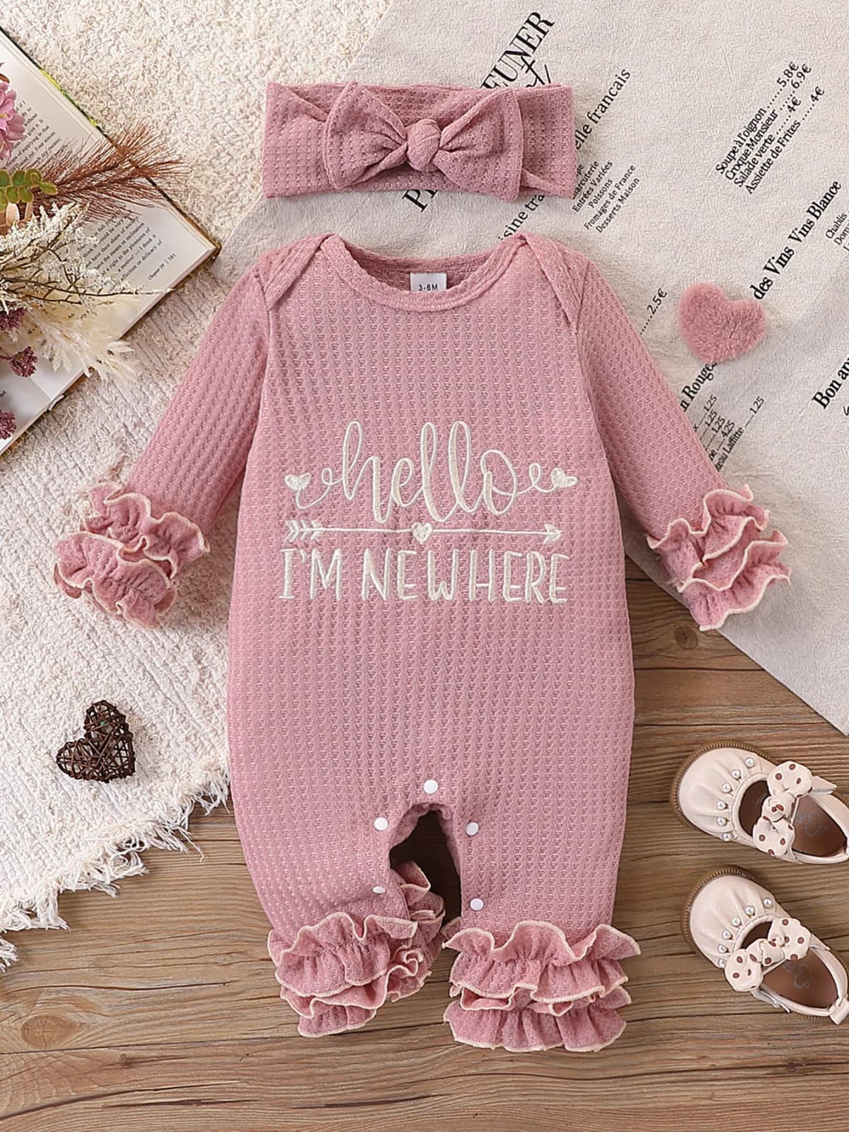 Newborn Baby Girl Waffle Knit Ruffle Romper Set – “Hello I’M New Here” Embroidered Letters, Multi-Layered Sleeves and Ruffles on the Feet, Snap Crotch Closure, Soft Hospital Discharge/Daily Sweet Romper + Matching Color Bow Headband