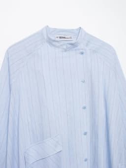 Spring and summer new women's clothing French round neck long sleeved asymmetrical hem flip chest pocket striped shirt