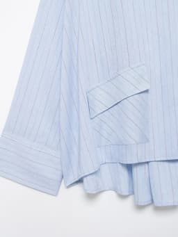 Spring and summer new women's clothing French round neck long sleeved asymmetrical hem flip chest pocket striped shirt