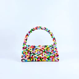 European and American same niche handmade color-blocked pearl triangle bag, fashionable and versatile hand-held bead bag