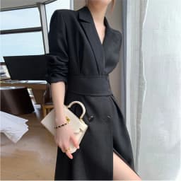A black long-sleeved dress that is slimming and elegant, with a suit-style design.