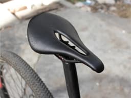 The New BALUGOE Carbon+Leather Road Bike Saddle MTB Bicycle Saddles Mountain Bike Racing Saddle PU Breathable Soft Seat Cushion