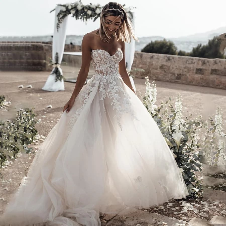 Customized Breathtaking Strapless Wedding Dress Featuring Stunning Crystals Lace Appliques and Flowy Silhouette Bridal Dress