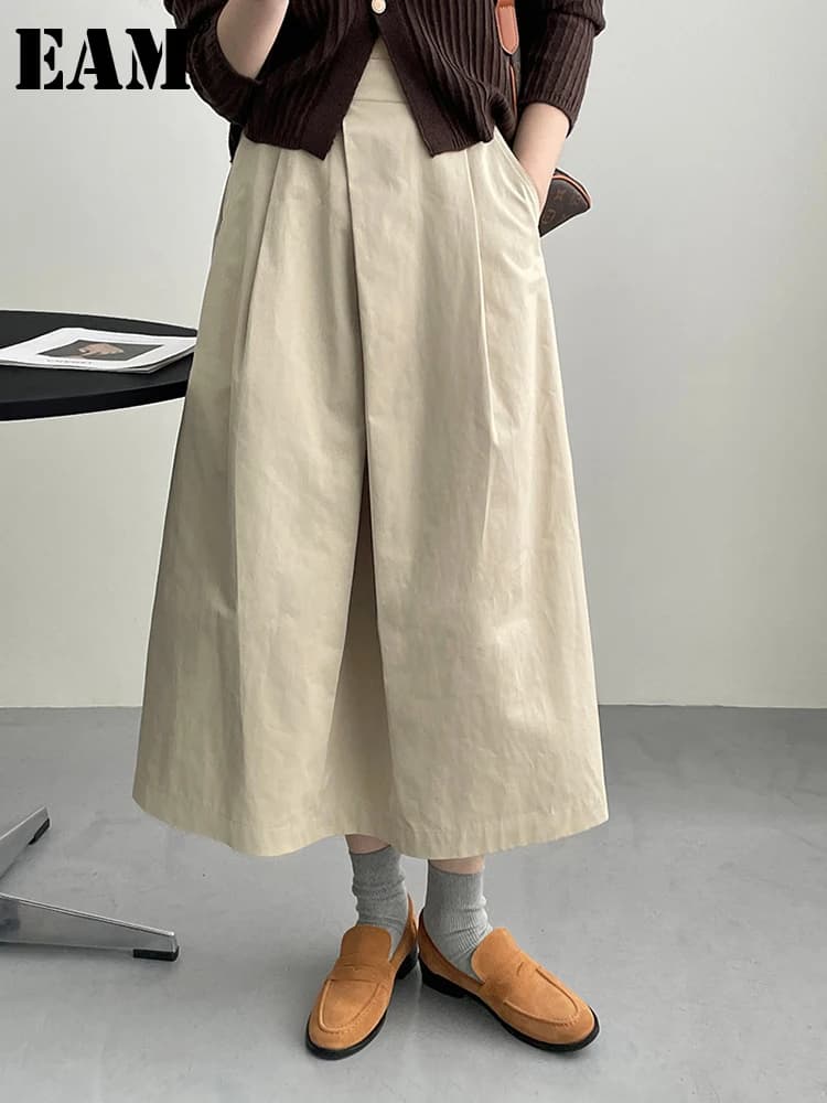 [EAM] High Waist Apricot A-line Irregular Pleated Elegant Half-body Skirt Women Fashion Tide New Spring Autumn 2026 1DH3802