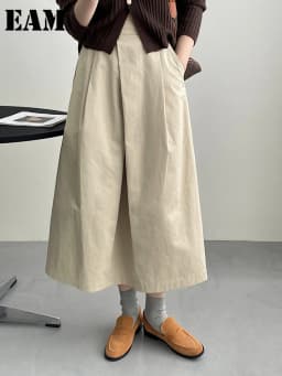 [EAM] High Waist Apricot A-line Irregular Pleated Elegant Half-body Skirt Women Fashion Tide New Spring Autumn 2026 1DH3802