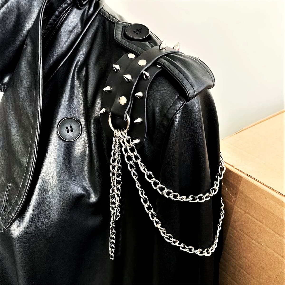 UYEE unisex synthetic leather shoulder armor with rivet details and chain tassel fashionable black studded waistband accessory
