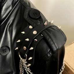 UYEE unisex synthetic leather shoulder armor with rivet details and chain tassel fashionable black studded waistband accessory