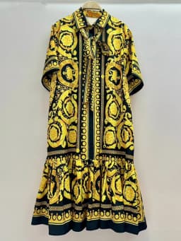 2026 Summer Women's New Fashion Geometric Print Lapel Short Sleeve Loose Dress Stitching Pleated Hem Temperament Straight Skirt.