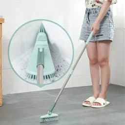 A long handled hard bristled triangular floor brush, bathroom tile gap cleaning brush