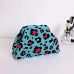 Trendy Cow Print Dot Handbag with High-End Color-Blocking Knitted Clip-On Design, Spacious and Versatile Fashion Tote.