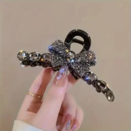 Elegant large acrylic bow hair clip with sparkling rhinestones - a fashionable solid color accessory for women and girls