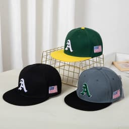 Hip-hop style baseball cap with a flat top, color patching, letter embroidery. Suitable for both women and men
